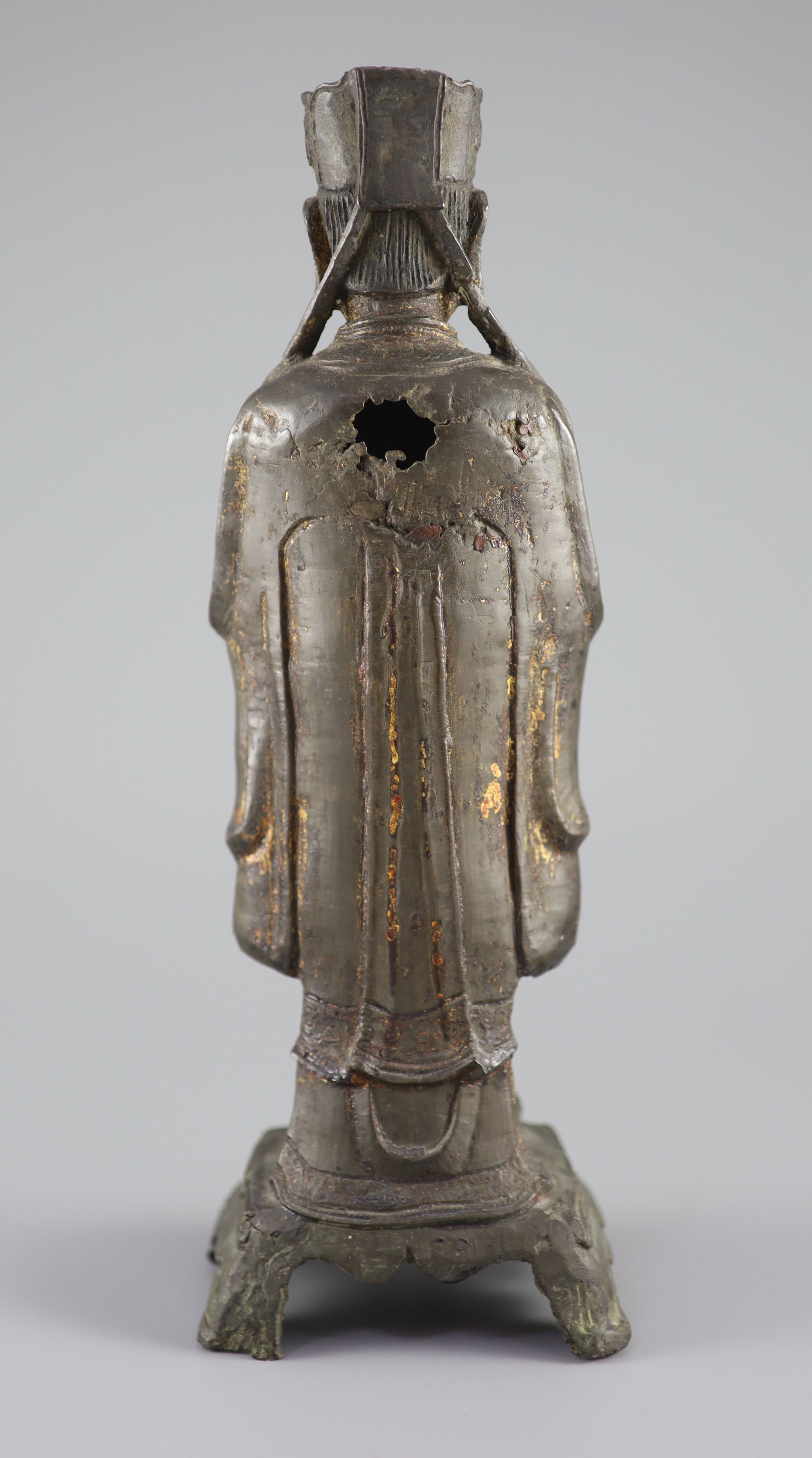 A Chinese bronze standing figure of an immortal, late Ming, 17th century, 31.3 cm high
